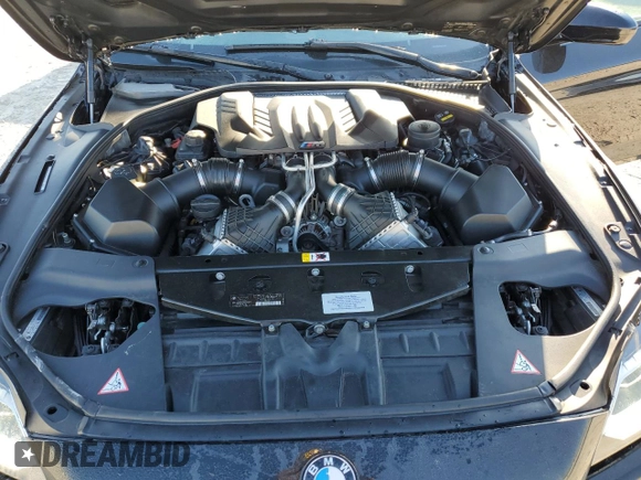 2015 BMW M6 z VIN WBS6C9C5XFD467952, wystawiony jako Copart lot #46312895 z przebiegiem 79 807 mil mil oraz Szkoda całkowita • Salvage title. Historia ofert i sprzedaży dostępna na DreamBid. Obrazek 11.