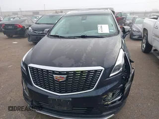 2021 Cadillac XT5 FWD Premium Luxury with VIN 1GYKNCRS2MZ185678, listed as a IAAI auction lot 41143084 with 25,399 mi miles and . Bid and sale history available at carsss.com. Image 12.