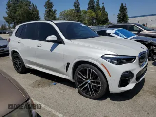 2019 BMW X5 xDrive40i with VIN 5UXCR6C57KLK85504, listed as a Copart auction lot 60908665 with 21,333 mi miles and Salvage title. Bid and sale history available at DreamBid. Image 4.