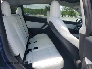 2022 Tesla Model Y Long Range z VIN 7SAYGDEE4NF426893, wystawiony jako Copart lot #55809275 z przebiegiem 16 083 mil mil oraz Szkoda całkowita • Salvage title. Historia ofert i sprzedaży dostępna na DreamBid. Obrazek 10.