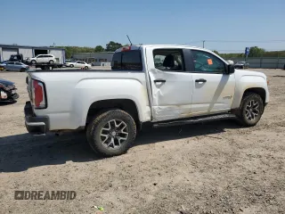 2021 GMC Canyon 4WD AT4 z VIN 1GTG6FEN5M1118081, wystawiony jako Copart lot #52452785 z przebiegiem 92 960 mil mil oraz Szkody całkowita. Historia ofert i sprzedaży dostępna na DreamBid. Obrazek 3.