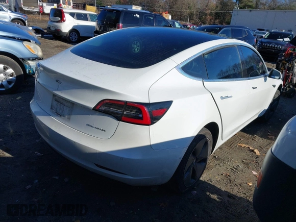 2018 Tesla Model 3 Long Range Battery with VIN 5YJ3E1EB5JF108633, listed as a IAAI auction lot 41016970 with 90,175 mi miles and . Bid and sale history available at DreamBid. Image 4.
