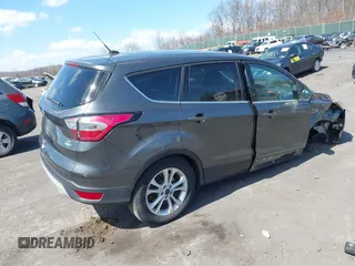 2017 Ford Escape SE with VIN 1FMCU9GD5HUC17297, listed as a IAAI auction lot 41880013 with 57,737 mi miles and . Bid and sale history available at DreamBid. Image 4.