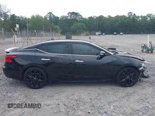 2018 Nissan Maxima Platinum z VIN 1N4AA6AP9JC392479, wystawiony jako IAAI lot #42209148 z przebiegiem 103 710 mil mil oraz . Historia ofert i sprzedaży dostępna na DreamBid. Obrazek 13.