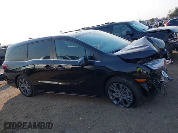 2025 Honda Odyssey Touring with VIN 5FNRL6H81SB011122, listed as a IAAI auction lot 41402170 with 2,968 mi miles and . Bid and sale history available at DreamBid. Image 14.