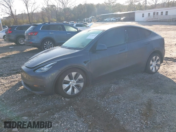 2022 Tesla Model Y Long Range with VIN 7SAYGAEE6NF361883, listed as a IAAI auction lot 41752441 with 50,493 mi miles and . Bid and sale history available at DreamBid. Image 2.