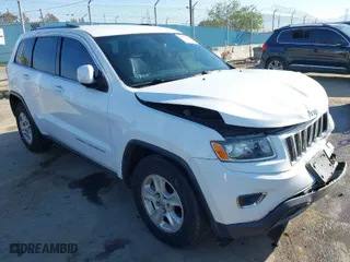 2014 Jeep Grand Cherokee Laredo with VIN 1C4RJEAGXEC130399, listed as a IAAI auction lot 41861664 with 106,925 mi miles. Bid and sale history available at carsss.com. Image 1.