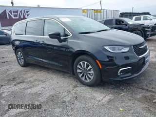 2023 Chrysler Pacifica Hybrid Touring L with VIN 2C4RC1L70PR575342, listed as a IAAI auction lot 41946079 with 36,304 mi miles and . Bid and sale history available at DreamBid. Image 1.