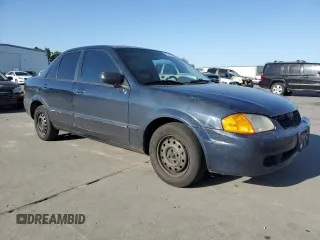 1999 Mazda Protege DX z VIN JM1BJ2227X0106522, wystawiony jako Copart lot #52423565 z przebiegiem 206 260 mil mil oraz Szkoda całkowita • Salvage title. Historia ofert i sprzedaży dostępna na DreamBid. Obrazek 4.
