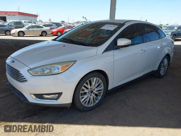 2015 Ford Focus Titanium with VIN 1FADP3J28FL256155, listed as a IAAI auction lot 42350610 with 53,840 mi miles and . Bid and sale history available at DreamBid. Image 2.