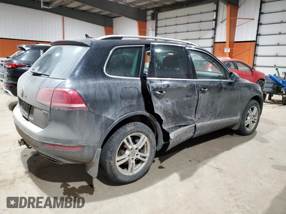 2013 Volkswagen Touareg Sport с VIN WVGEP9BP5DD008301, выставлен на аукционе Copart как лот 85085984 с пробегом 204 735 миль миль и Списание • Salvage title. История ставок и продаж доступна на DreamBid. Изображение 3.