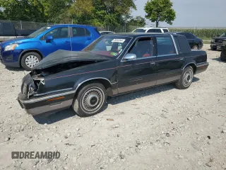 1992 Chrysler New Yorker z VIN 1C3XV66R2ND759195, wystawiony jako Copart lot #69650044 z przebiegiem 70 387 mil mil oraz Szkody całkowita. Historia ofert i sprzedaży dostępna na DreamBid. Obrazek 1.