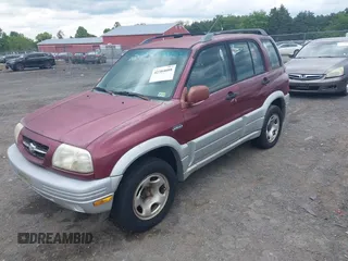 2000 Suzuki Grand Vitara JLX z VIN JS3TD62V7Y4119022, wystawiony jako IAAI lot #42384608 z przebiegiem 153 943 mil mil oraz . Historia ofert i sprzedaży dostępna na DreamBid. Obrazek 2.