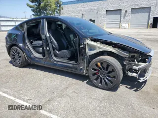 2022 Tesla Model Y Performance z VIN 7SAYGDEF2NF443037, wystawiony jako Copart lot #56870145 z przebiegiem 51 897 mil mil oraz Szkoda całkowita • Salvage title. Historia ofert i sprzedaży dostępna na DreamBid. Obrazek 4.