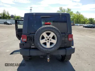 2014 Jeep Wrangler Sport with VIN 1C4AJWAG2EL113843, listed as a Copart auction lot 62771115 with 70,089 mi miles and Salvage title. Bid and sale history available at DreamBid. Image 6.
