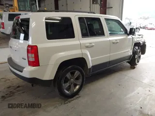 2014 Jeep Patriot Latitude with VIN 1C4NJPFA0ED680509, listed as a IAAI auction lot 41801775 with 147,418 mi miles and . Bid and sale history available at carsss.com. Image 4.