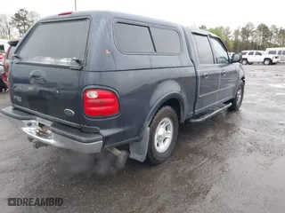 2001 Ford F-150 SuperCrew XLT with VIN 1FTRW07L41KB78053, listed as a IAAI auction lot 41965594 with 303,647 mi miles. Bid and sale history available at carsss.com. Image 4.