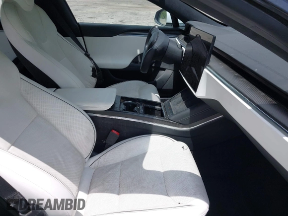 2022 Tesla Model S Plaid with VIN 5YJSA1E61NF460155, listed as a IAAI auction lot 42545167 with 51,711 mi miles and . Bid and sale history available at DreamBid. Image 5.