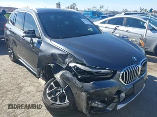 2020 BMW X1 sDrive28i with VIN WBXJG7C04L3L80986, listed as a IAAI auction lot 41376285 with 51,070 mi miles. Bid and sale history available at carsss.com. Image 1.