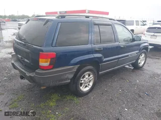 2002 Jeep Grand Cherokee Laredo with VIN 1J4GW48S22C244433, listed as a IAAI auction lot 41892912 with 256,393 mi miles. Bid and sale history available at carsss.com. Image 4.