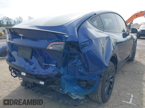 2022 Tesla Model Y Long Range with VIN 7SAYGDEE0NA019067, listed as a IAAI auction lot 41645198 with 49,336 mi miles and . Bid and sale history available at DreamBid. Image 4.