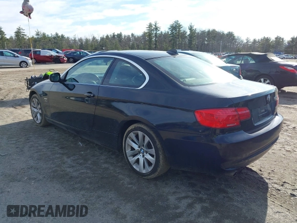 2011 BMW 3 Series 328i xDrive with VIN WBAKF5C52BE655212, listed as a IAAI auction lot 41802186 with 185,014 mi miles. Bid and sale history available at carsss.com. Image 3.