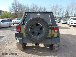 2013 Jeep Wrangler Unlimited Sport with VIN 1C4BJWDG5DL577949, listed as a IAAI auction lot 41837172 with 142,235 mi miles. Bid and sale history available at carsss.com. Image 16.