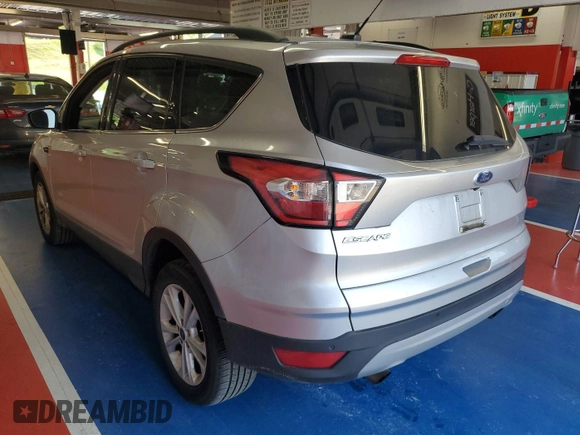 2018 Ford Escape SE z VIN 1FMCU9GD3JUC13075, wystawiony jako IAAI lot #42537659 z przebiegiem 77 270 mil mil oraz . Historia ofert i sprzedaży dostępna na DreamBid. Obrazek 16.