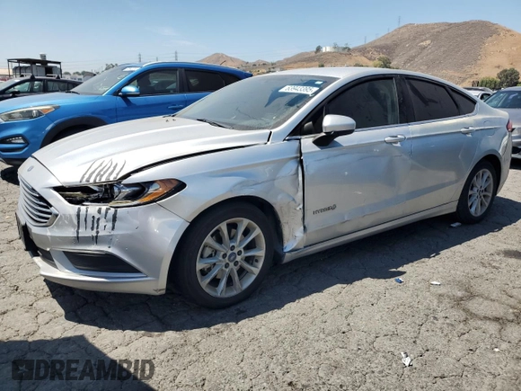 2017 Ford Fusion Hybrid SE z VIN 3FA6P0LU9HR306927, wystawiony jako Copart lot #63943395 z przebiegiem 157 851 mil mil oraz Czysty tytuł • Clean title. Historia ofert i sprzedaży dostępna na DreamBid. Obrazek 1.