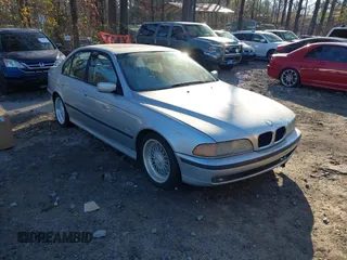 2000 BMW 5 Series 528iA with VIN WBADM6340YGU19599, listed as a IAAI auction lot 41139764 with 233,657 mi miles. Bid and sale history available at carsss.com. Image 1.