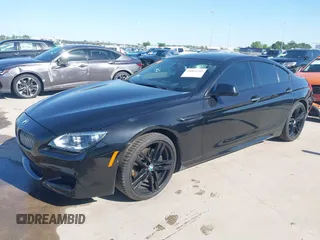 2014 BMW 6 Series 650i z VIN WBA6B2C55ED129419, wystawiony jako IAAI lot #39061341 z przebiegiem 68 790 mil mil oraz . Historia ofert i sprzedaży dostępna na DreamBid. Obrazek 17.
