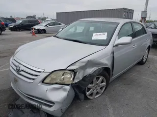 2005 Toyota Avalon XL with VIN 4T1BK36B25U036071, listed as a IAAI auction lot 42100456 with 185,898 mi miles and . Bid and sale history available at carsss.com. Image 2.