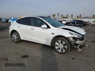 2023 Tesla Model Y Long Range with VIN 7SAYGDEE5PA125887, listed as a Copart auction lot 43188655 with 31,472 mi miles and Salvage Title. Bid and sale history available at DreamBid. Image 4.