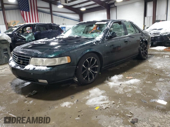 2000 Cadillac Seville Touring STS z VIN 1G6KY5494YU220613, wystawiony jako Copart lot #87338724 z przebiegiem 106 313 mil mil oraz Szkoda całkowita • Salvage title. Historia ofert i sprzedaży dostępna na DreamBid. Obrazek 1.