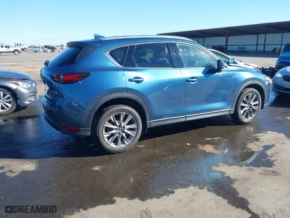 2021 Mazda CX-5 Grand Touring with VIN JM3KFBDM7M0311552, listed as a IAAI auction lot 41856871 with 47,330 mi miles. Bid and sale history available at carsss.com. Image 4.