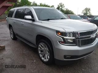 2015 Chevrolet Suburban LT z VIN 1GNSCJKC9FR617227, wystawiony jako IAAI lot #42127511 z przebiegiem 167 924 mil mil oraz . Historia ofert i sprzedaży dostępna na DreamBid. Obrazek 1.