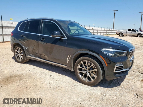 2021 BMW X5 sDrive40i with VIN 5UXCR4C09M9G23111, listed as a Copart auction lot 60509475 with 34,230 mi miles and Salvage title. Bid and sale history available at DreamBid. Image 4.