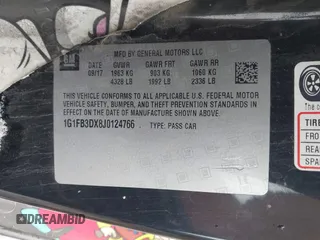 2018 Chevrolet Camaro 1LT with VIN 1G1FB3DX8J0124766, listed as a IAAI auction lot 41737430 with 101,028 mi miles. Bid and sale history available at carsss.com. Image 9.