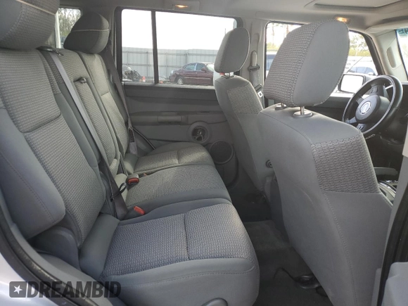 2006 Jeep Commander with VIN 1J8HH48K96C289162, listed as a Copart auction lot 80979074 with 170,581 mi miles and Salvage title. Bid and sale history available at DreamBid. Image 11.