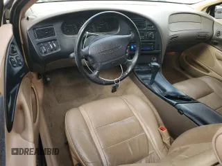 1997 Ford Thunderbird LX with VIN 1FALP62W5VH124101, listed as a Copart auction lot 47547695 with 148,828 mi miles and Salvage Title. Bid and sale history available at carsss.com. Image 8.