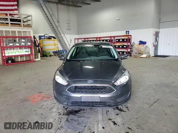 2018 Ford Focus SE z VIN 1FADP3FE4JL289830, wystawiony jako Copart lot #53350265 z przebiegiem 72 963 mil mil oraz Szkoda całkowita • Salvage title. Historia ofert i sprzedaży dostępna na DreamBid. Obrazek 13.