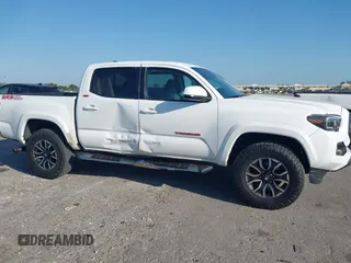 2018 Toyota Tacoma SR with VIN 5TFAX5GN2JX128621, listed as a IAAI auction lot 41797514 with 216,251 mi miles and . Bid and sale history available at DreamBid. Image 13.