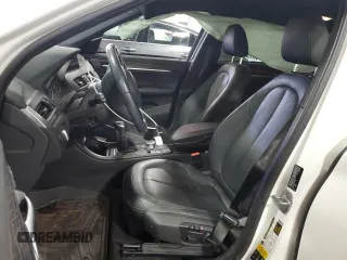 2017 BMW X1 xDrive28i with VIN WBXHT3Z38H4A53824, listed as a Copart auction lot 52500215 with 106,782 mi miles and Salvage title. Bid and sale history available at DreamBid. Image 7.