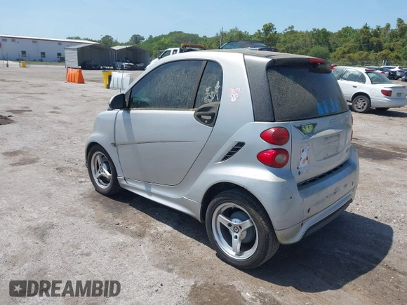 2013 Smart fortwo Pure with VIN WMEEJ3BA1DK632883, listed as a IAAI auction lot 42102529 with 74,071 mi miles. Bid and sale history available at carsss.com. Image 3.