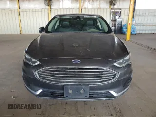 2020 Ford Fusion SEL z VIN 3FA6P0CD3LR131180, wystawiony jako Copart lot #63843355 z przebiegiem 146 705 mil mil oraz Czysty tytuł • Clean title. Historia ofert i sprzedaży dostępna na DreamBid. Obrazek 5.