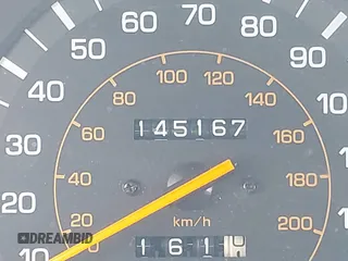 1990 Toyota Camry z VIN 4T1SV24E0LU190211, wystawiony jako IAAI lot #42368986 z przebiegiem 145 167 mil mil oraz . Historia ofert i sprzedaży dostępna na DreamBid. Obrazek 15.