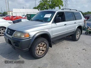 2003 Mitsubishi Montero Sport XLS with VIN JA4MT31R03J023679, listed as a IAAI auction lot 41872682 with 148,365 mi miles. Bid and sale history available at carsss.com. Image 2.