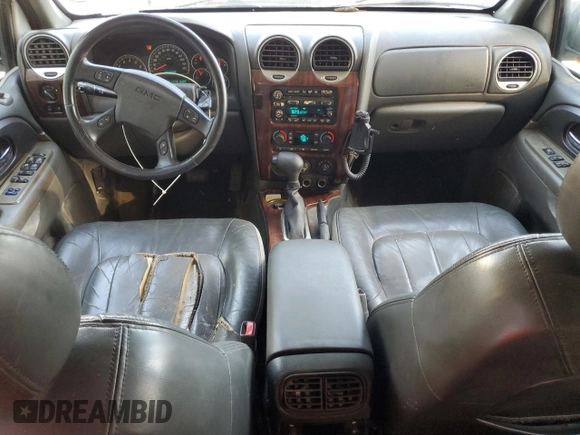 2002 GMC Envoy SLT with VIN 1GKDS13S822460095, listed as a Copart auction lot 77004764 with 267,716 mi miles and Salvage Title. Bid and sale history available at carsss.com. Image 8.