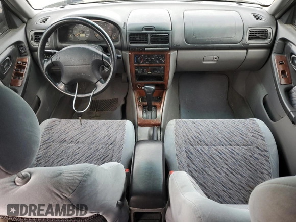 1999 Subaru Forester S with VIN JF1SF6550XH735142, listed as a Copart auction lot 85818264 with 0 mi miles and Salvage Title. Bid and sale history available at carsss.com. Image 8.
