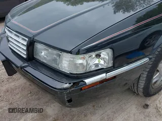 2002 Cadillac Eldorado ESC z VIN 1G6EL12Y82B105241, wystawiony jako IAAI lot #42241609 z przebiegiem 90 442 mil mil oraz . Historia ofert i sprzedaży dostępna na DreamBid. Obrazek 6.